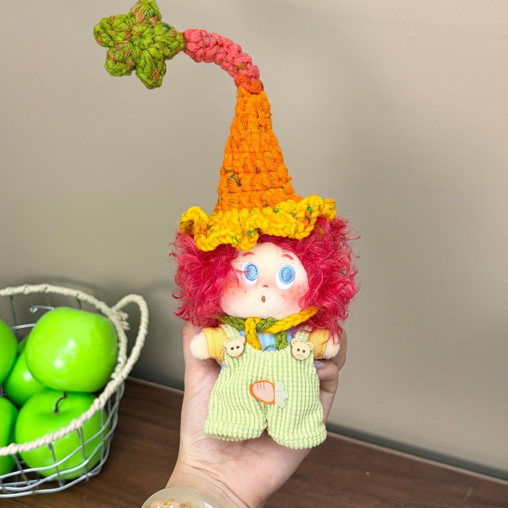 Supplied product photograph: red curly-haired doll with a star-topped pointed hat. Style reference 3; outfit and hat details vary.